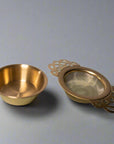 Bronze tea strainer and bowl