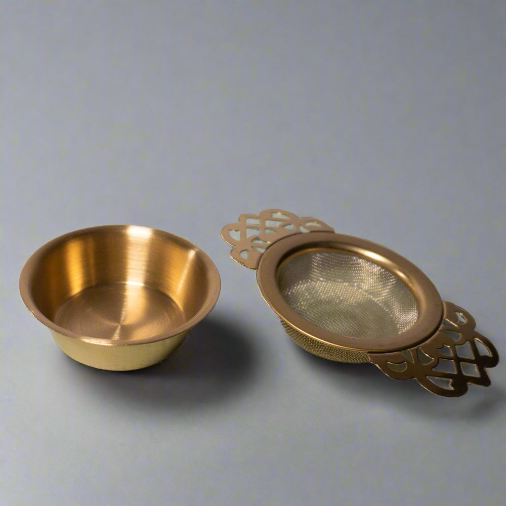 Bronze tea strainer and bowl 